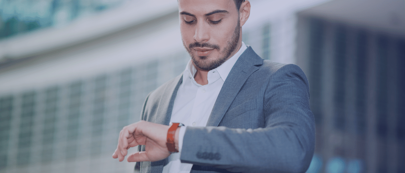 man looking at watch