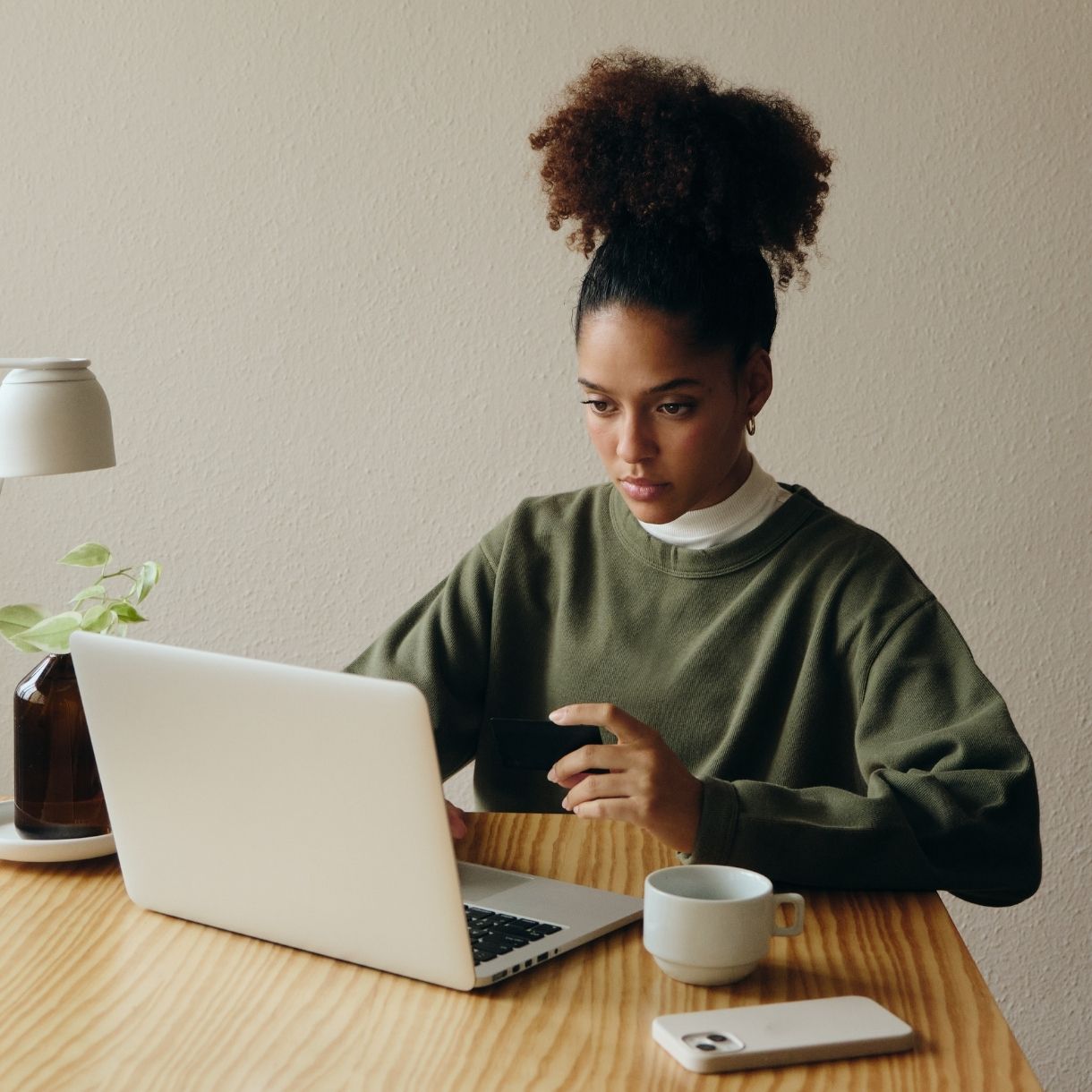 Woman reviewing finances on laptop